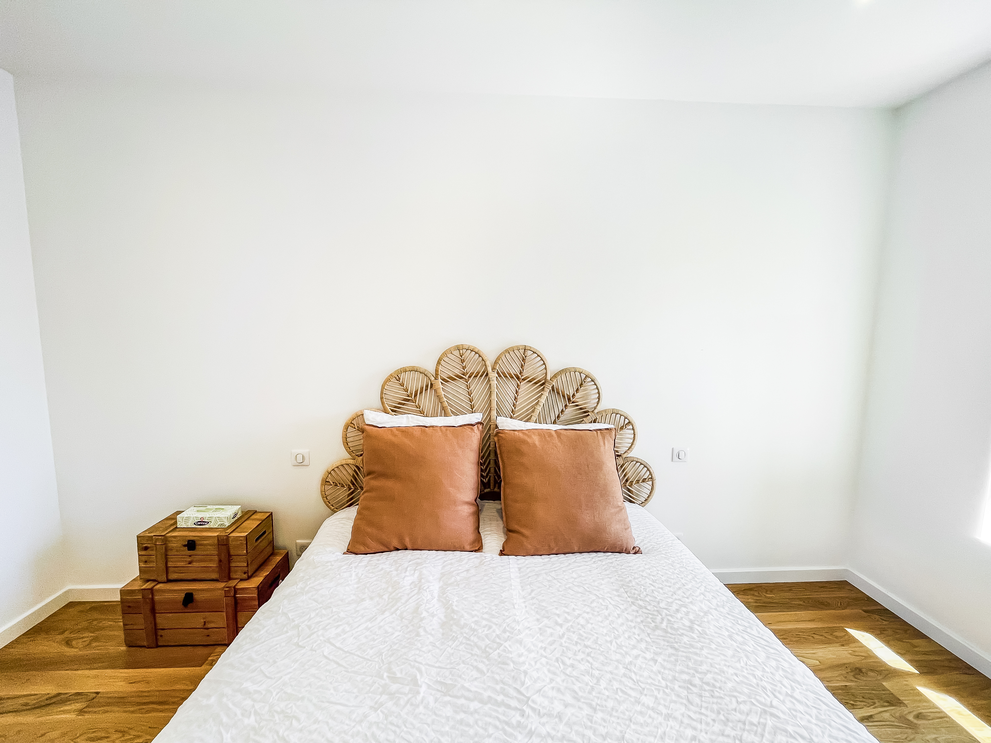Master bedroom with rattan headboard